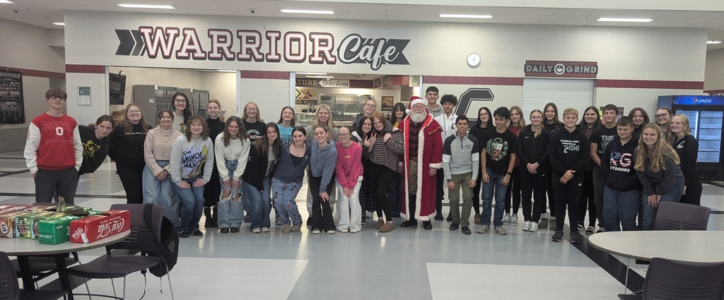 students posing with Santa