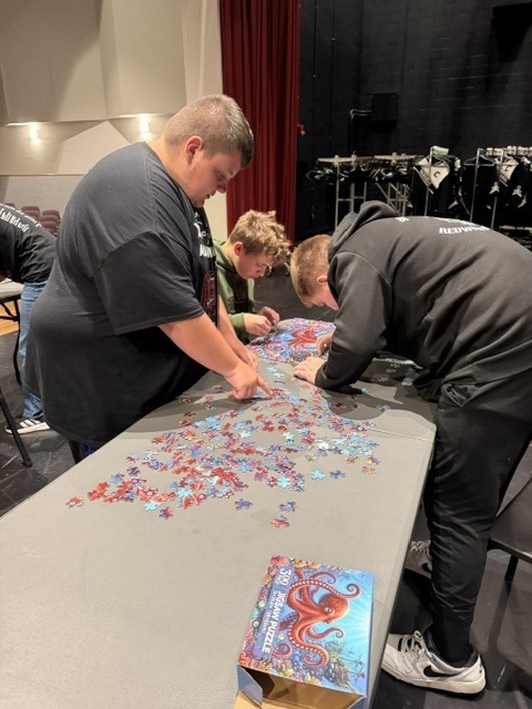 students working on a puzzle