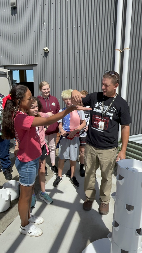 students staff releasing butterflies