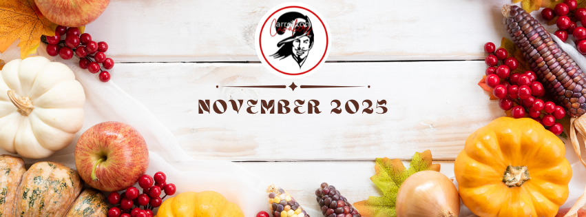 A white wooden background decorated with autumn produce, including pumpkins, apples, cranberries, colorful ears of corn, and fall leaves arranged along the top and bottom edges. At the center top is the Carrollton Cavaliers logo featuring a stylized Cavalier head inside a red circle. Below the logo, centered in dark brown decorative text, are the words “November 2025.”