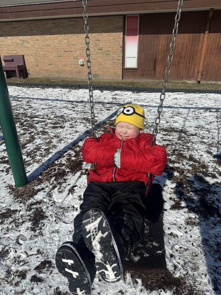 Child swinging on swing