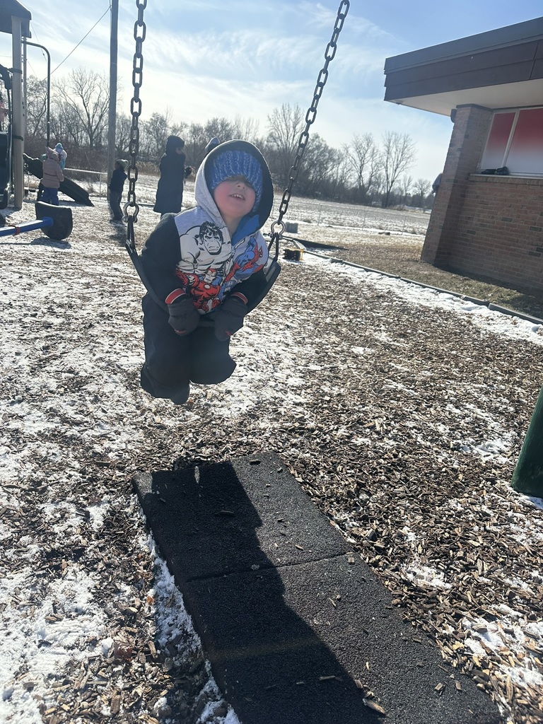 Child swinging on swing