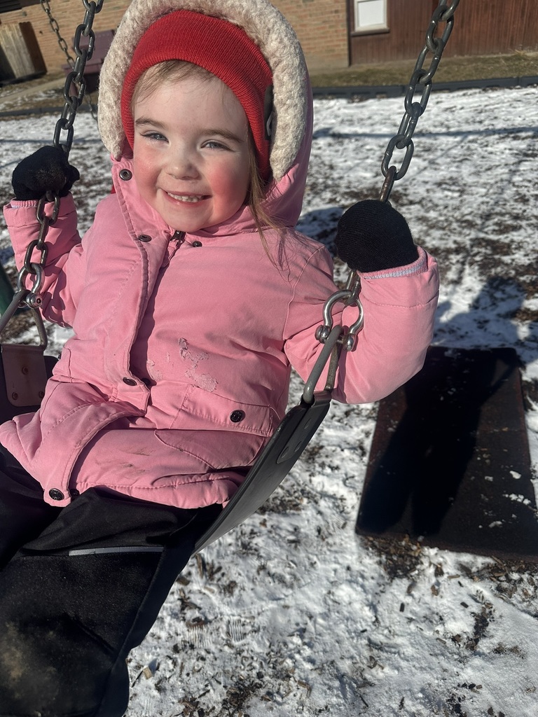 Child swinging on swing