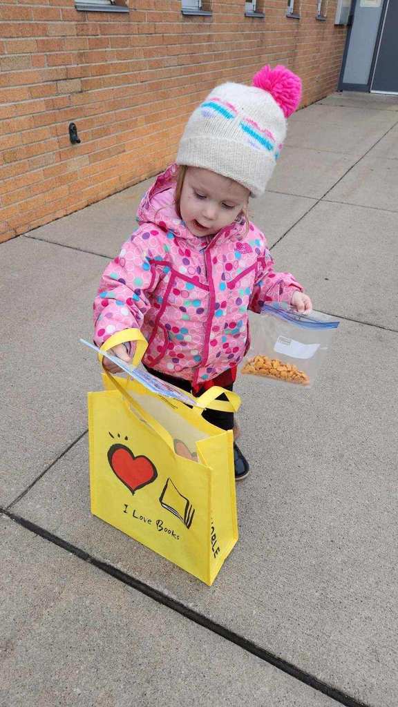 January Bookmobile raffle prize winner with prizes