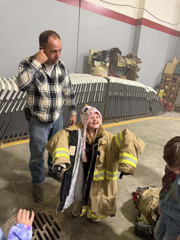 Trying on the fire gear is SO fun!