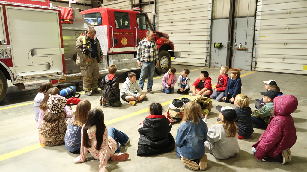 3rd Grade Tigers learning about the trucks and fire gear!