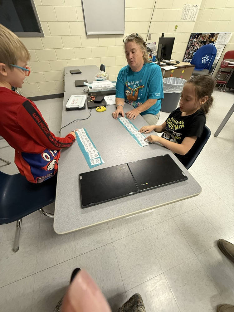 images of students doing work in math