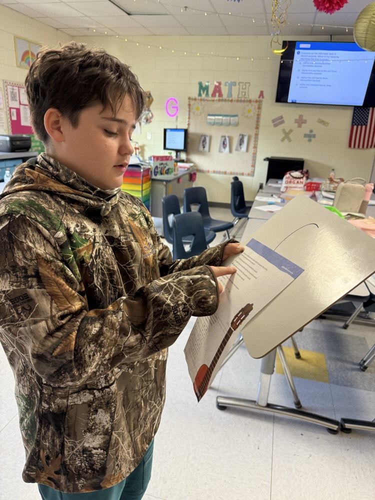 images of students doing work at TCES