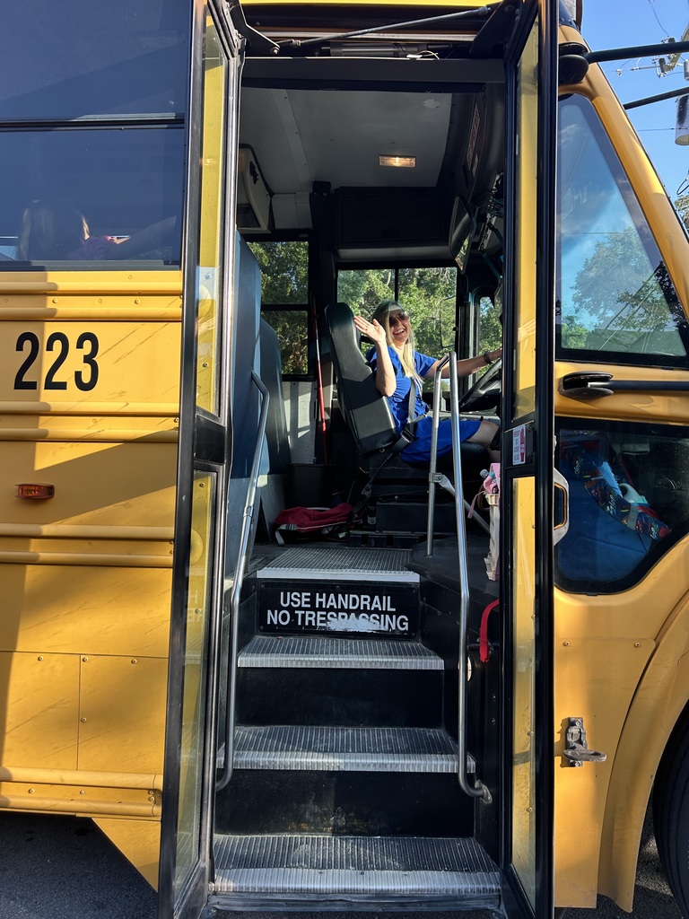 Principal Arthur driving a bus for Atlantic Elementary School