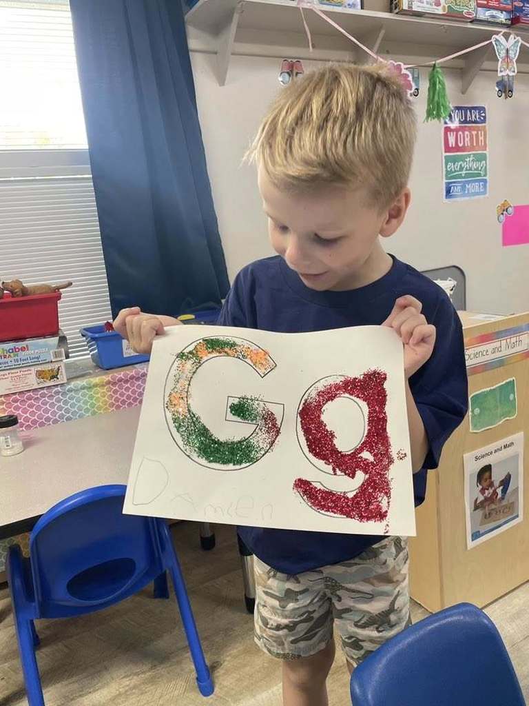 Student with the letter G project