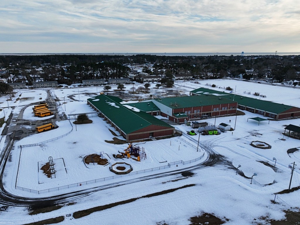 Photo of Beaufort Elementary School. The grounds are covered in snow. 