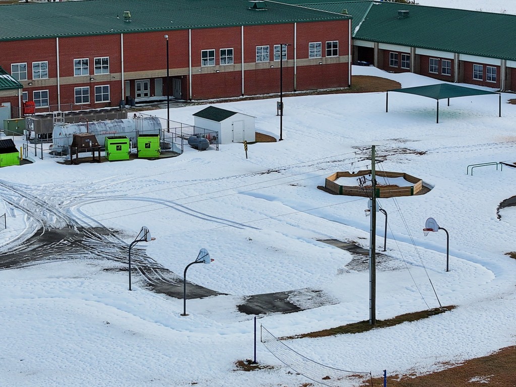 Photo of Beaufort Elementary School. The grounds are covered in snow. 