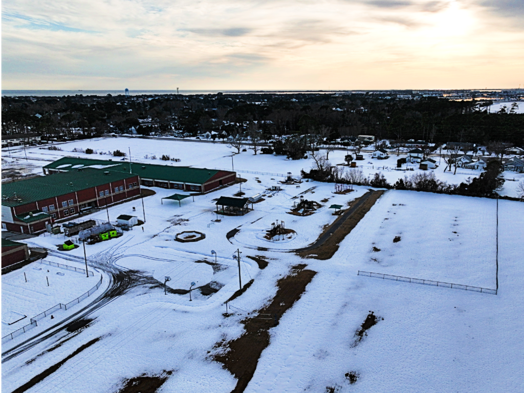 Photo of Beaufort Elementary School. The grounds are covered in snow. 