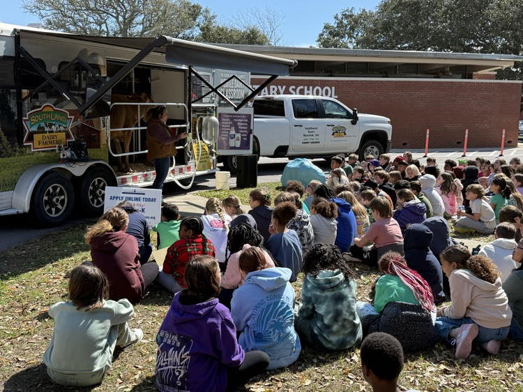 Pictures of students during the mobile dairy classroom presentation 