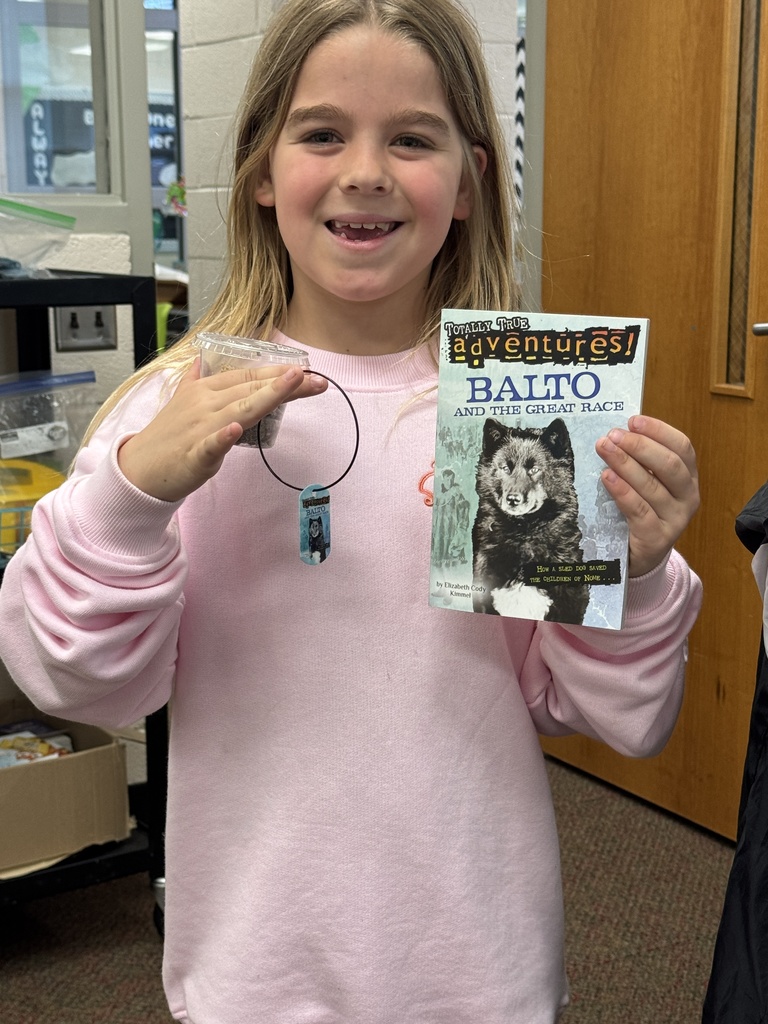 student holding Balto book