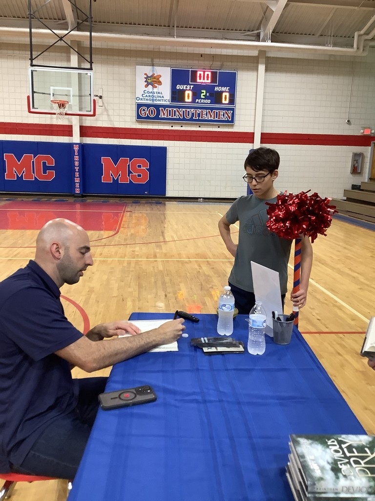 Scott Reintgen with student