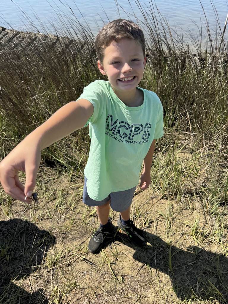 student holding crab