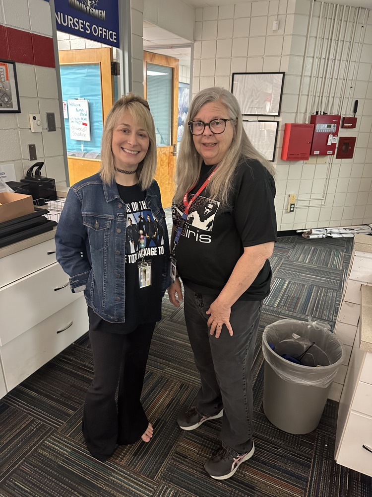 staff wearing band tshirt 