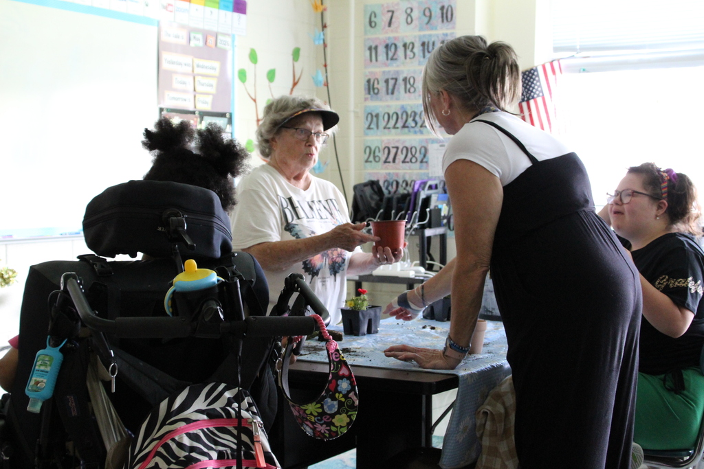 Liz Kappel explains how to plant a flower.