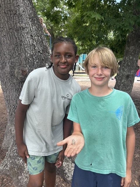 Students with Civil War bullet