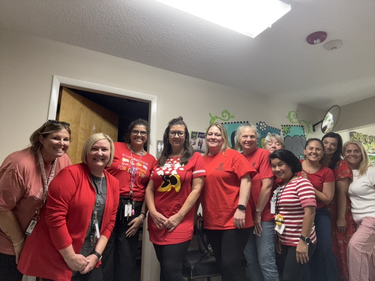 group picture of staff wearing red