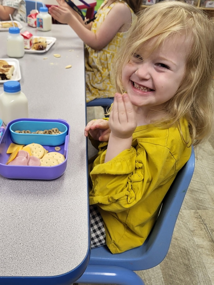 smiling child wearing yellow