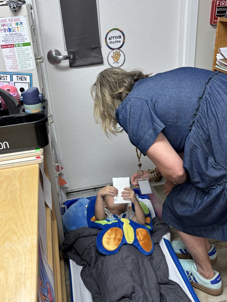 lady talking to student on cot 