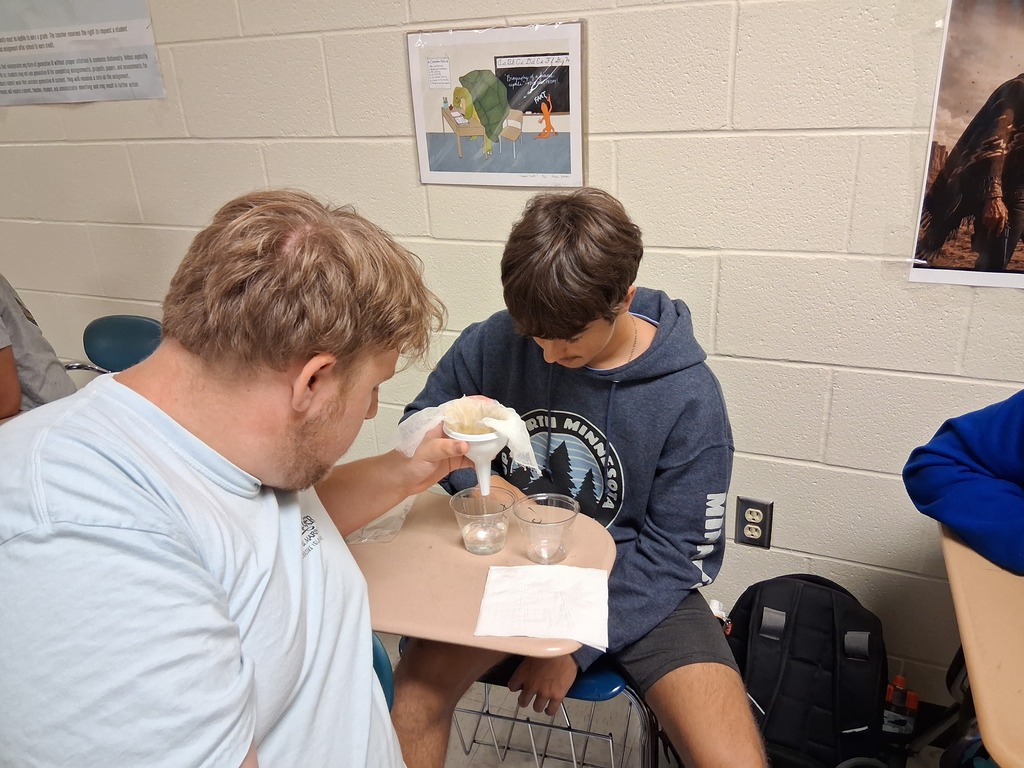Riley and Garrison work on the project