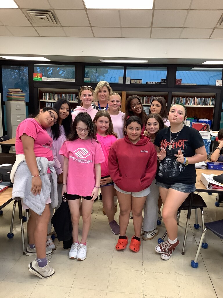 Students with teacher in pink