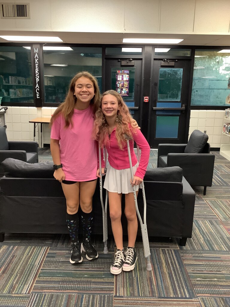two girls in pink