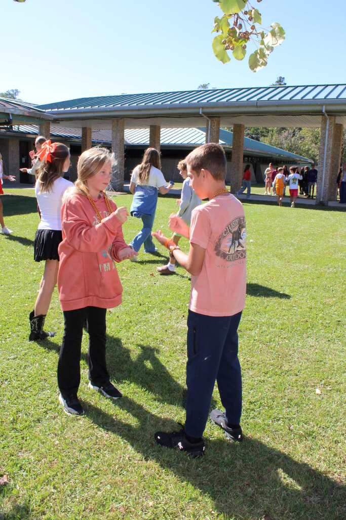 Students playing rock, paper, scissors