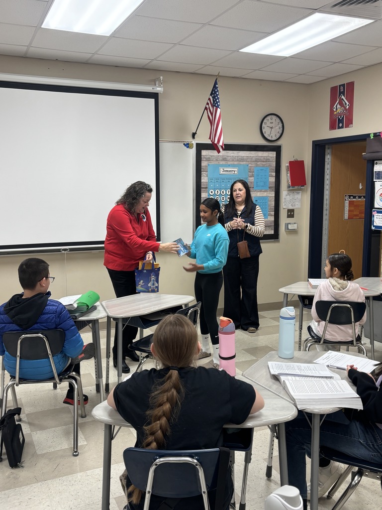 Sayha being presented her postcard.  