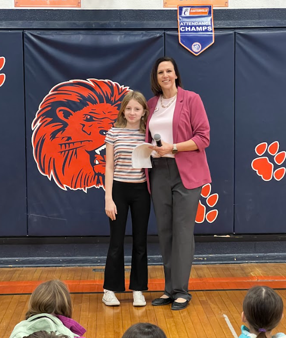 Chloe being recognized in the gymnasium