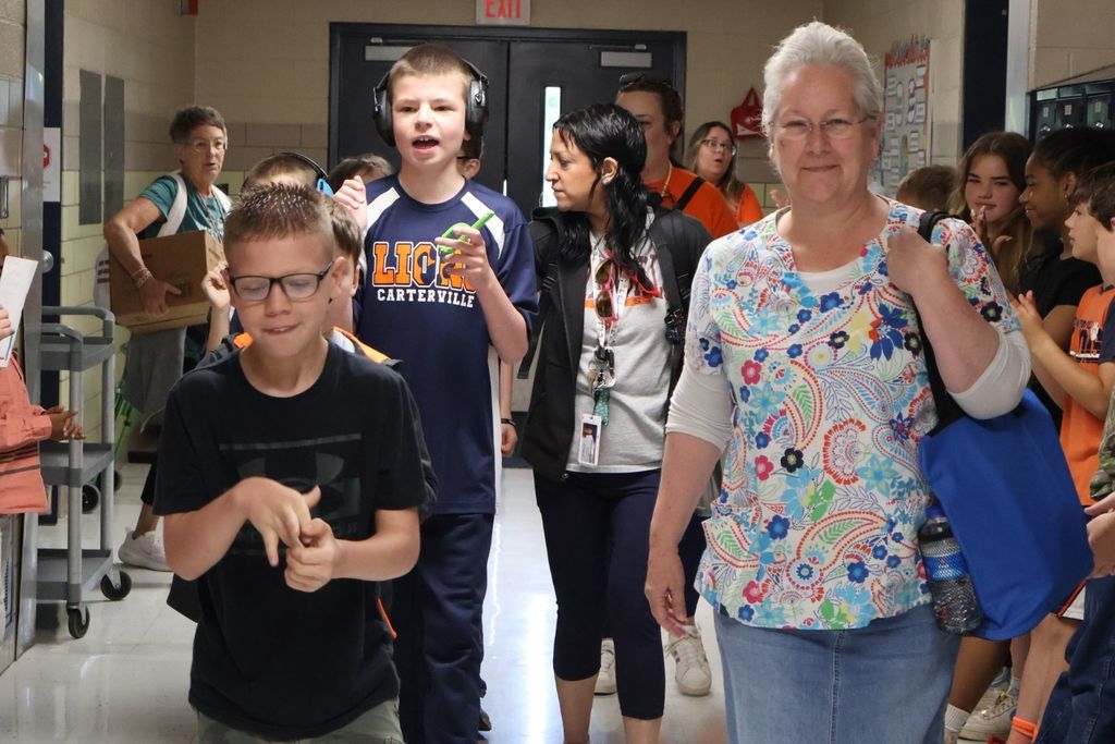 Athletes walking down the hall