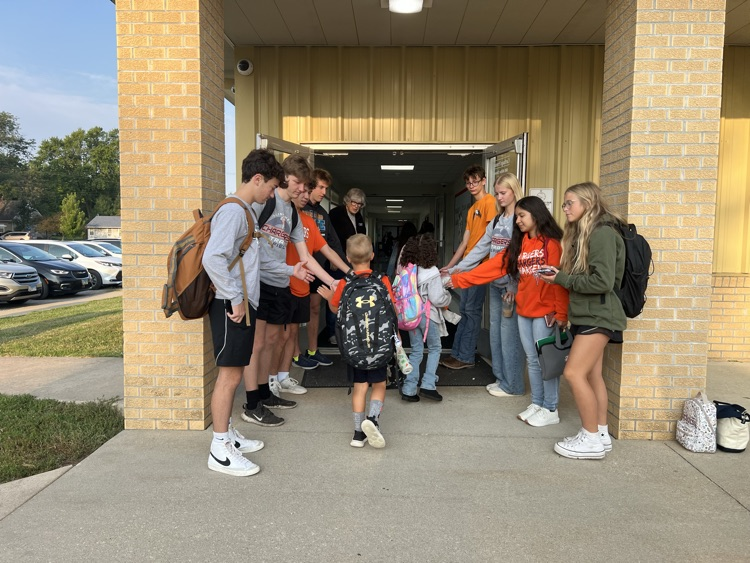 students walking into building 