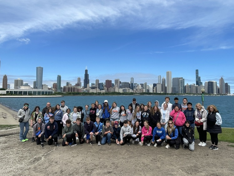 the whole group near Lake Michigan with the skyline behind 