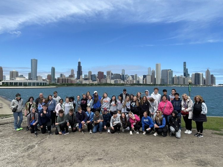 the whole group near Lake Michigan with the skyline behind 