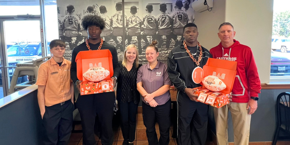 DaQuives Beck and KJ Edwards presented with the 2025 Whataburger Super Team award