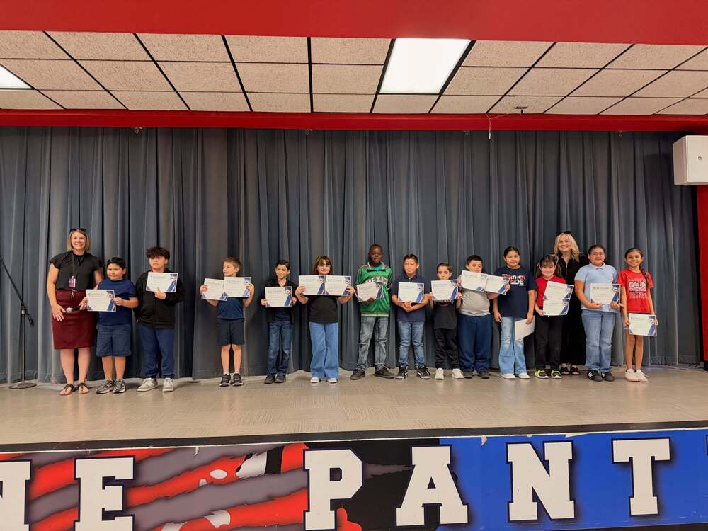 Group of students stands with their certificates