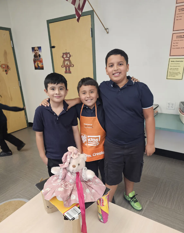 Three students with STEM project