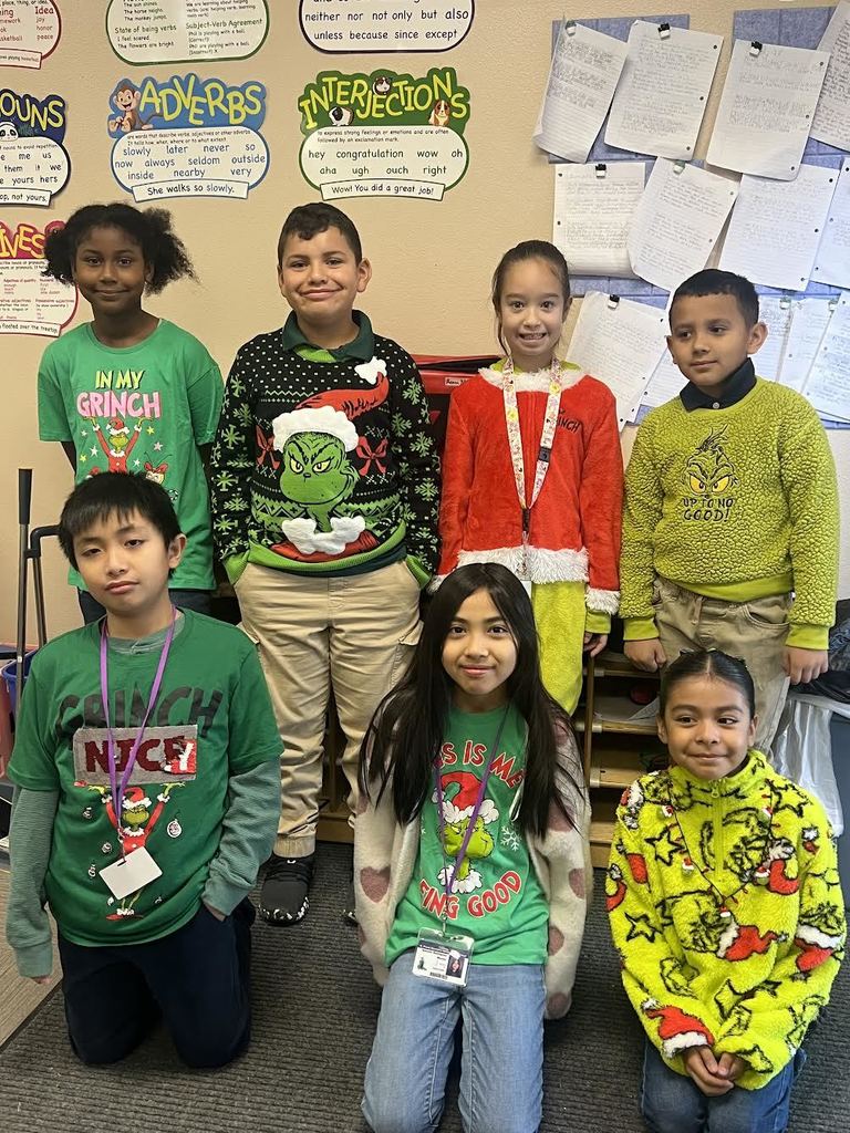 students wearing grinch-themed clothes
