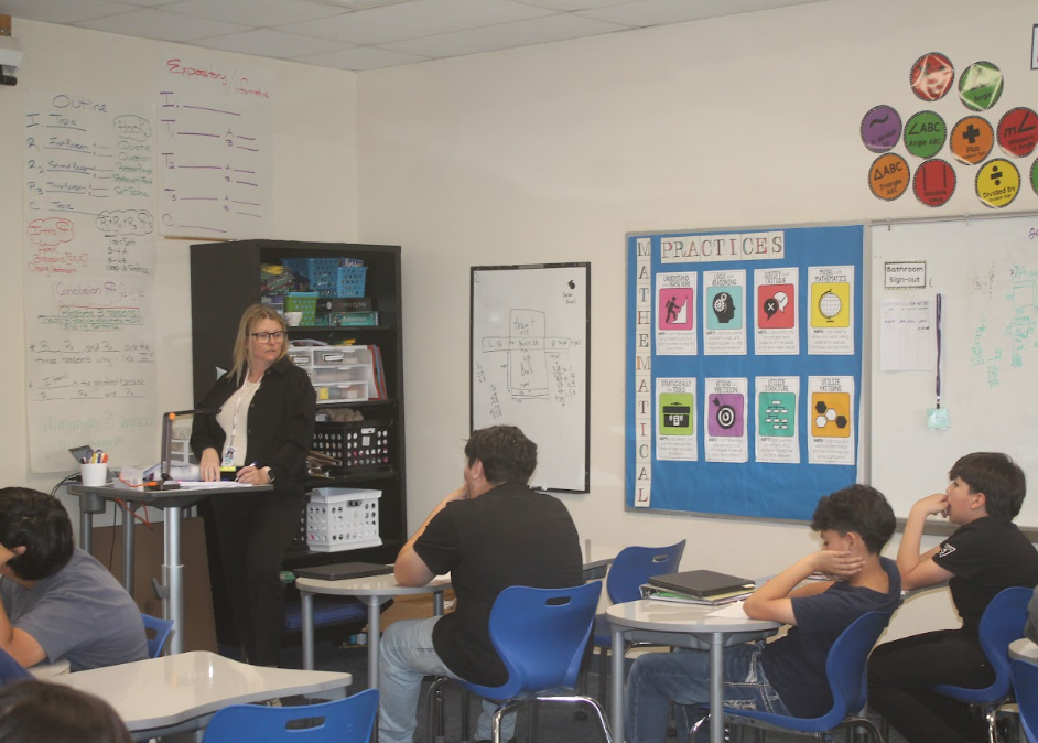 7th grade students in ELA, Science, Math, and Social Studies classrooms actively participating in hands-on and multimedia lessons while teachers guide instruction.