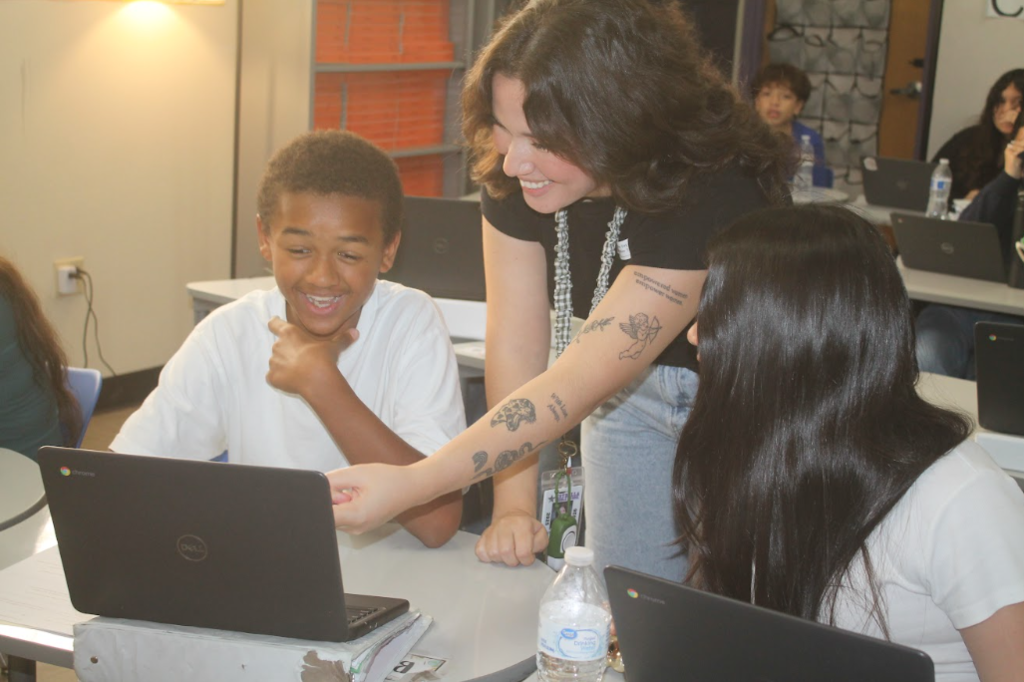 7th grade students in ELA, Science, Math, and Social Studies classrooms actively participating in hands-on and multimedia lessons while teachers guide instruction.