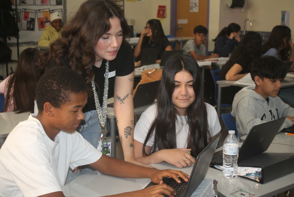 7th grade students in ELA, Science, Math, and Social Studies classrooms actively participating in hands-on and multimedia lessons while teachers guide instruction.