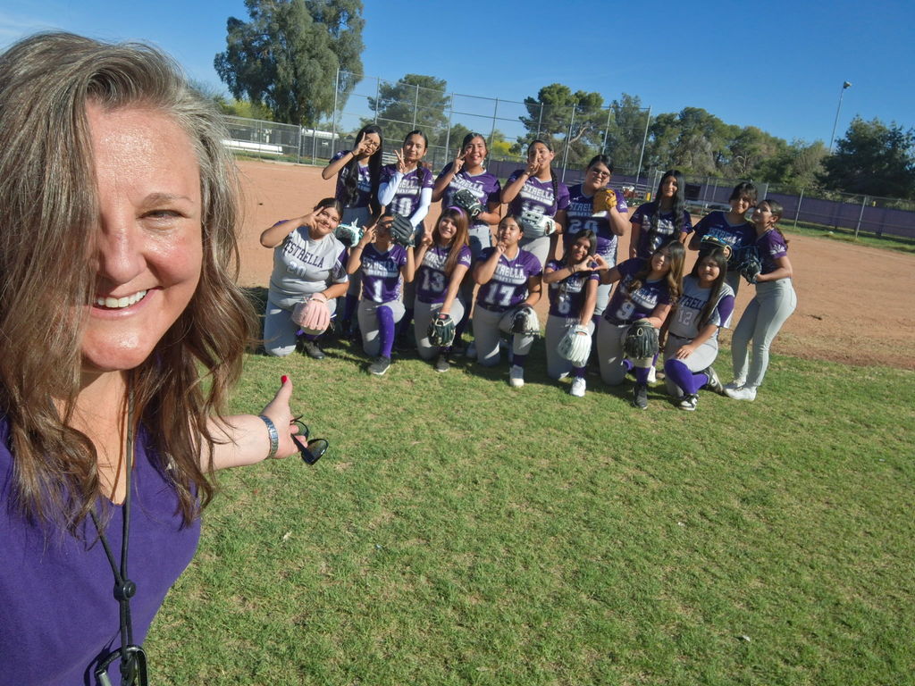 The softball team and coach