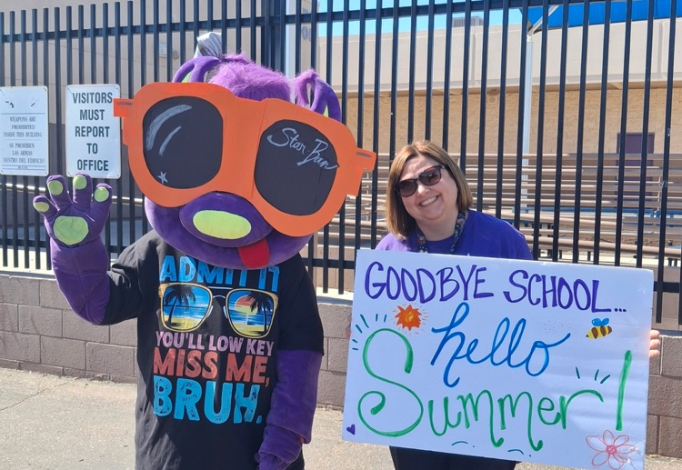 JB holding poster saying goodbye school