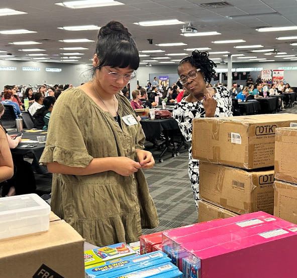 Lady looking at boxes in a table