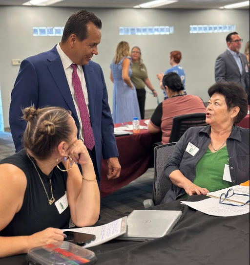 Man talking to two ladies