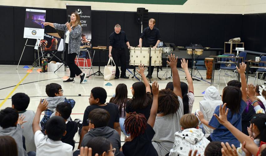 Jordanna Matlock, left, of the Phoenix Symphony Orchestra along with members Shaun Tilburg and Matt Pendergast were asked a number of questions by eager Cottonwood Elementary students.