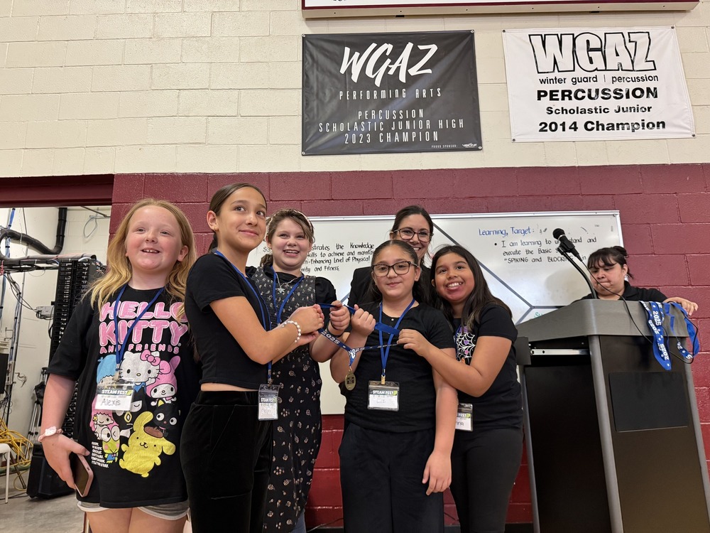 5 female students winning a medal at STEAM Fest
